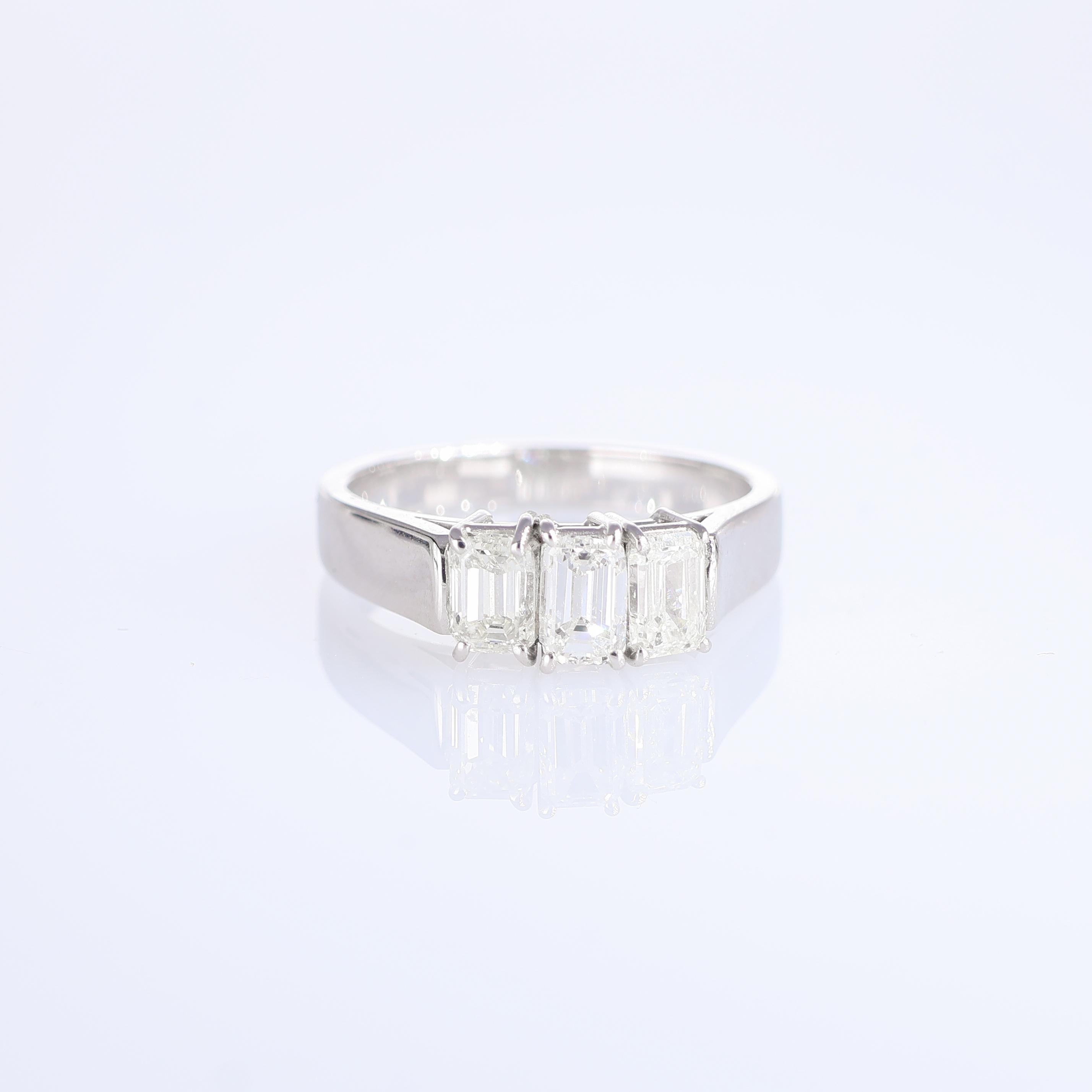 IMPORTANT NOTE:
✔ No additional costs will be added to this order.
✔ Shipping and customs duties are fully covered by us.
--------------------
A timeless masterpiece, this 18-karat white gold ring features three stunning emerald-cut diamonds,
