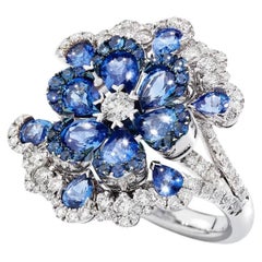 Anillo de Oro Blanco con Diamantes Blancos y Zafiros Azules