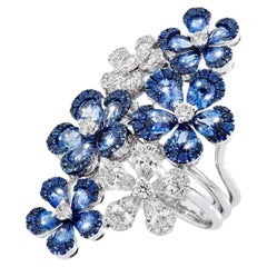 Anillo de Oro Blanco con Diamantes Blancos y Zafiros Azules