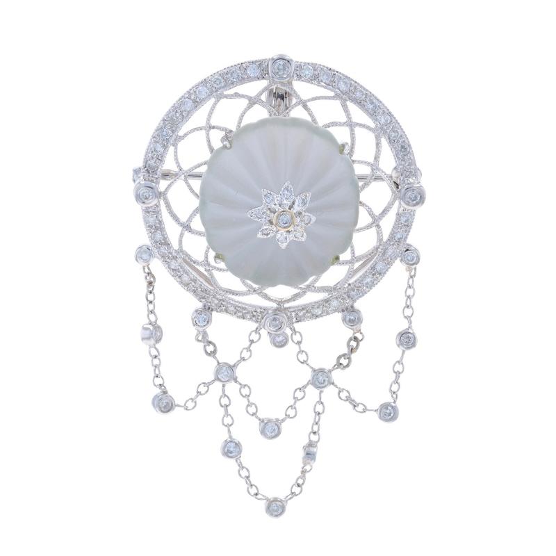 Metal Content: 18k White Gold

Stone Information

Natural Rock Crystal
Cut: Carved
Color: Colorless

Natural Diamonds
Carat(s): .67ctw
Cut: Round Brilliant
Color: F - G
Clarity: I1 - I2

Total Carats: .67ctw

Style: Convertible Brooch/Enhancer