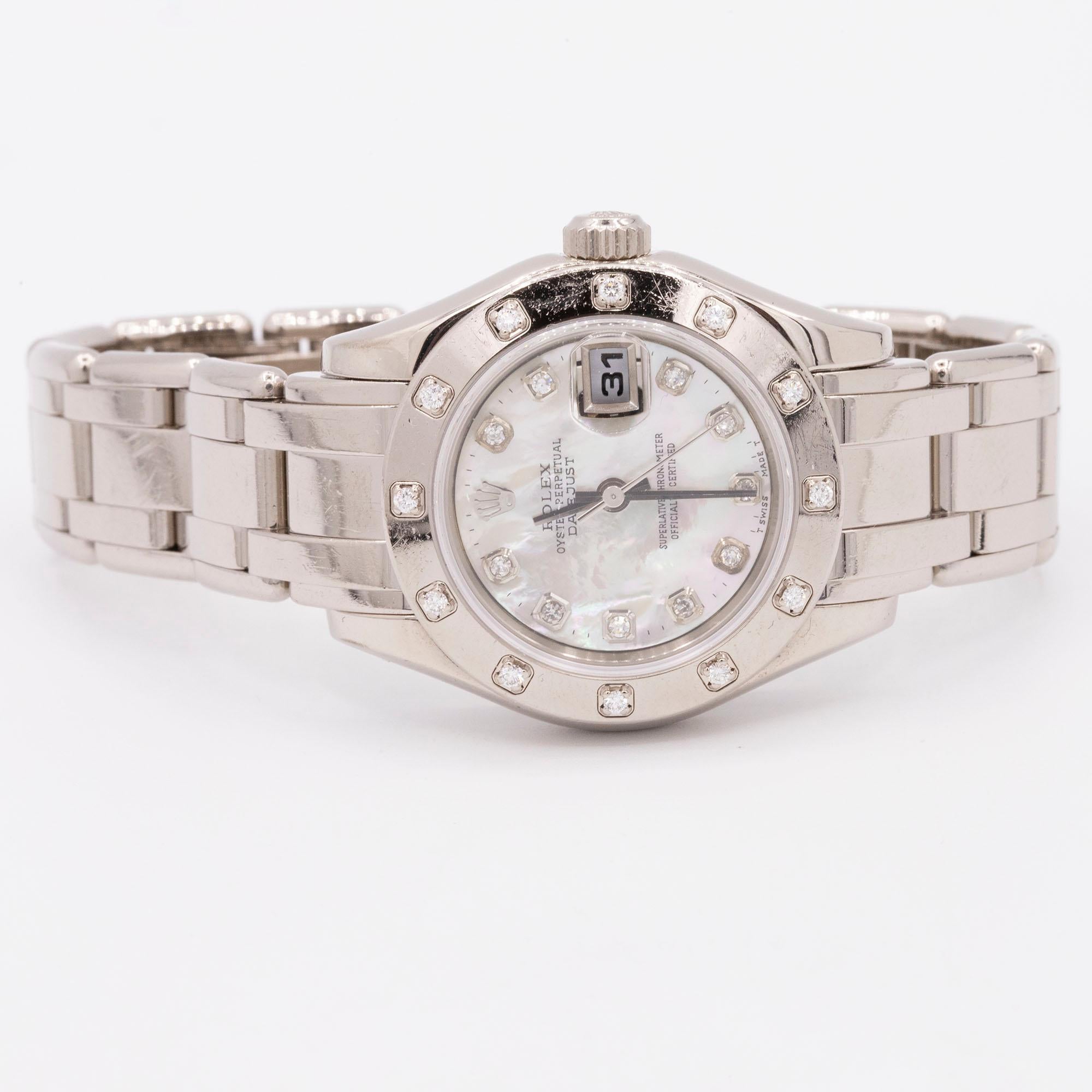 A neo-vintage Rolex Pearlmaster finished in white gold and featuring a mother-of-pearl dial with diamond hour markers, the bezel of the timepiece also set with diamonds. The watch features a date at 3 o'clock with cyclops lens and diamond markers.