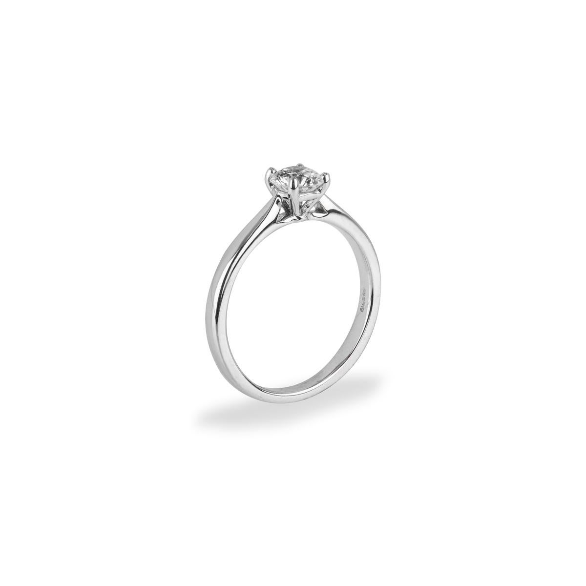 A classic 18k white gold diamond solitaire ring. The engagement ring is set to the centre with a round brilliant cut diamond in a four claw mount, weighing 0.59ct, G colour VS2 clarity. The 2mm solitaire has a gross weight of 2.92 grams and is