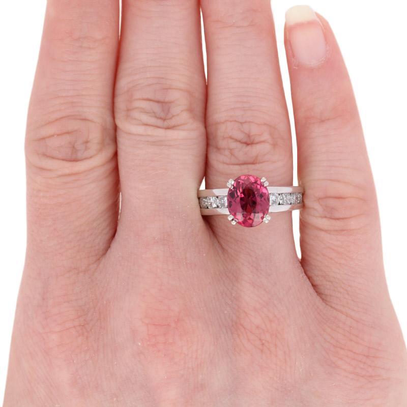 Size: 7
Sizing Fee: Up 1/2 a size for $30

Metal Content: 18k White Gold 

Stone Information: 
Genuine Rubellite Tourmaline
Carat: 3.18ct
Cut: Oval
Color: Reddish Purple
Size: 9.9mm x 8mm

Natural Diamonds
Carats: 1.06ctw
Cut: Round Brilliant
Color: