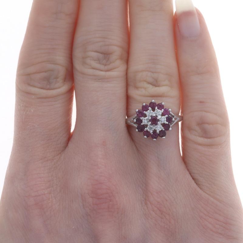 Size: 5
Sizing Fee: Up 1 1/2 sizes for $30 or Down 1 size for $30

Metal Content: 10k White Gold

Stone Information

Natural Rubies
Treatment: Heating
Carat(s): 1.04ctw
Cut: Round
Color: Pinkish & Purplish Reds

Natural Diamonds
Carat(s):