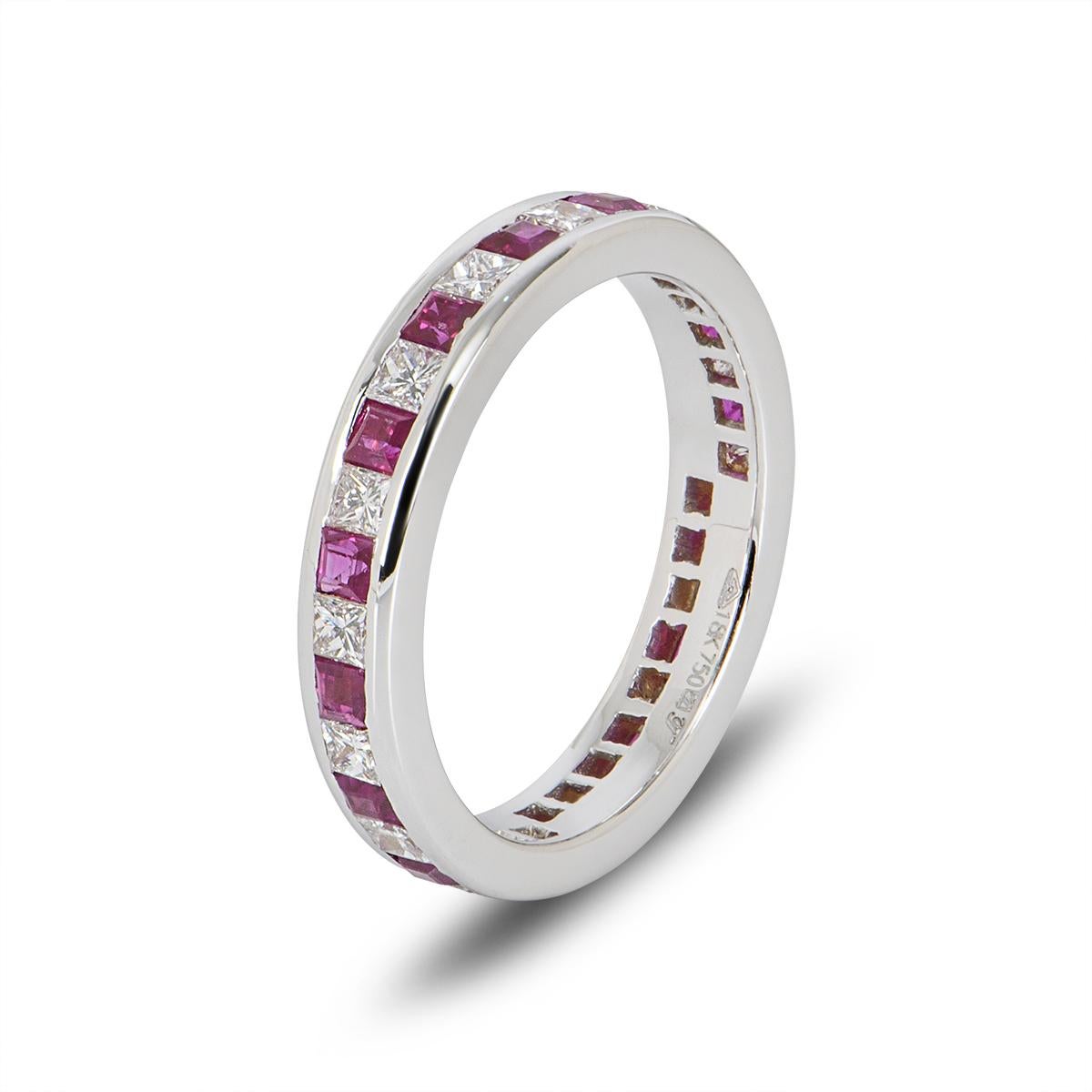 A beautiful 18k white gold ruby and diamond full eternity ring. The ring is channel set with 15 square cut rubies with an approximate weight of 0.92ct and 16 princess cut diamonds with an approximate weight of 0.82ct. The ring measures 3.7mm wide,