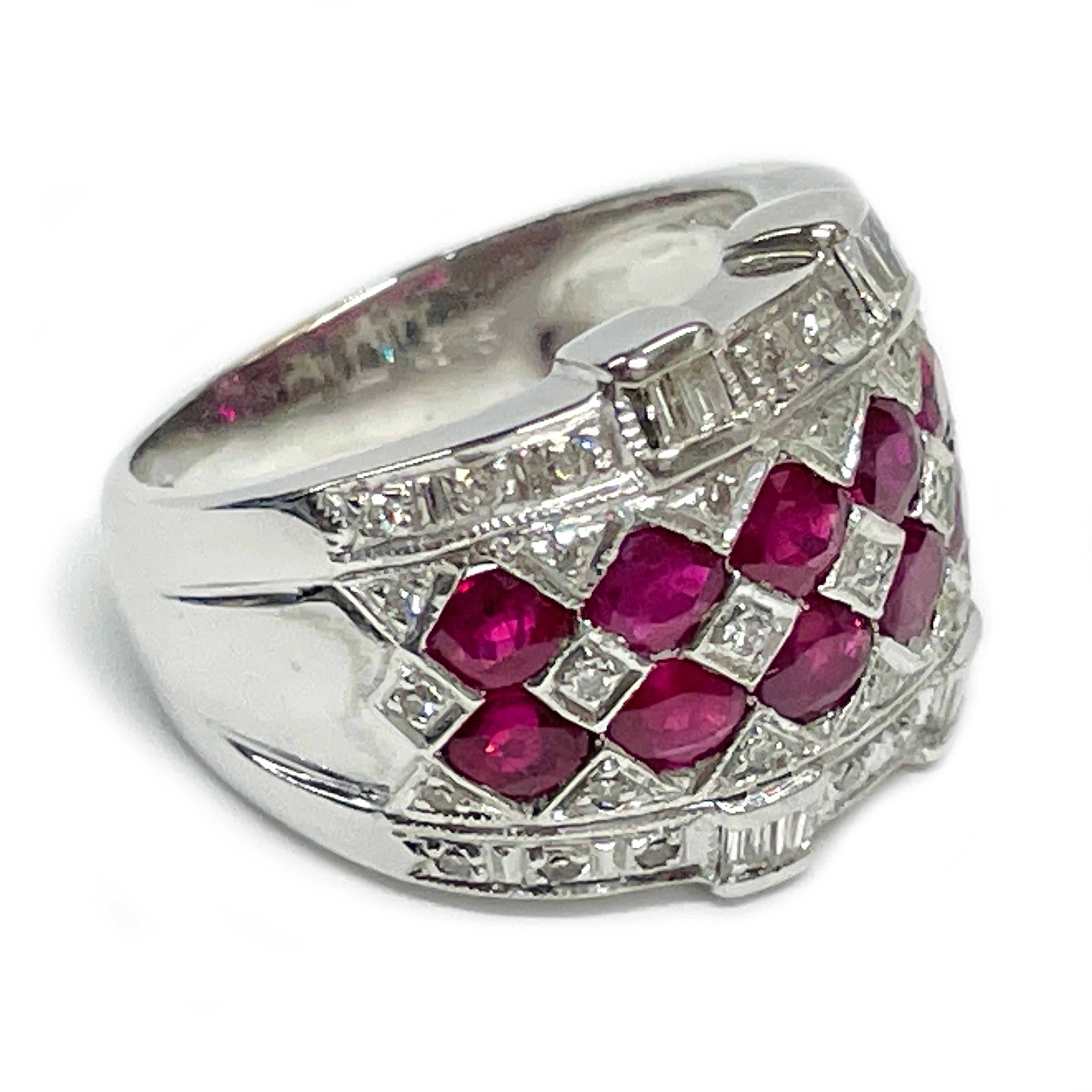 14 Karat White Gold Ruby Diamond Ring. The ring features twelve 3.5 x 3mm oval rubies, eight tapered baguette diamonds, and thirty-seven 3.5mm single cut diamonds. The rubies have a carat total weight of 0.41ctw. The diamonds have a carat total