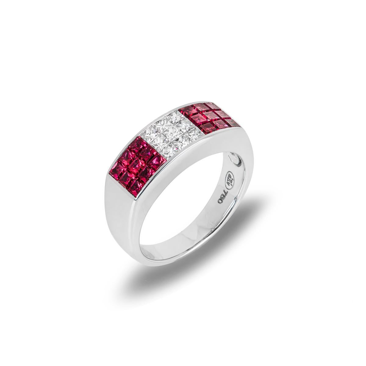 A ruby and diamond dress ring set in 18k white gold. The ring is composed of 18 princess cut rubies totalling 2.00ct and 9 princess cut diamonds totalling 0.50ct. The ring is 7mm in width, has a gross weight of 7.80 grams and is currently a size UK