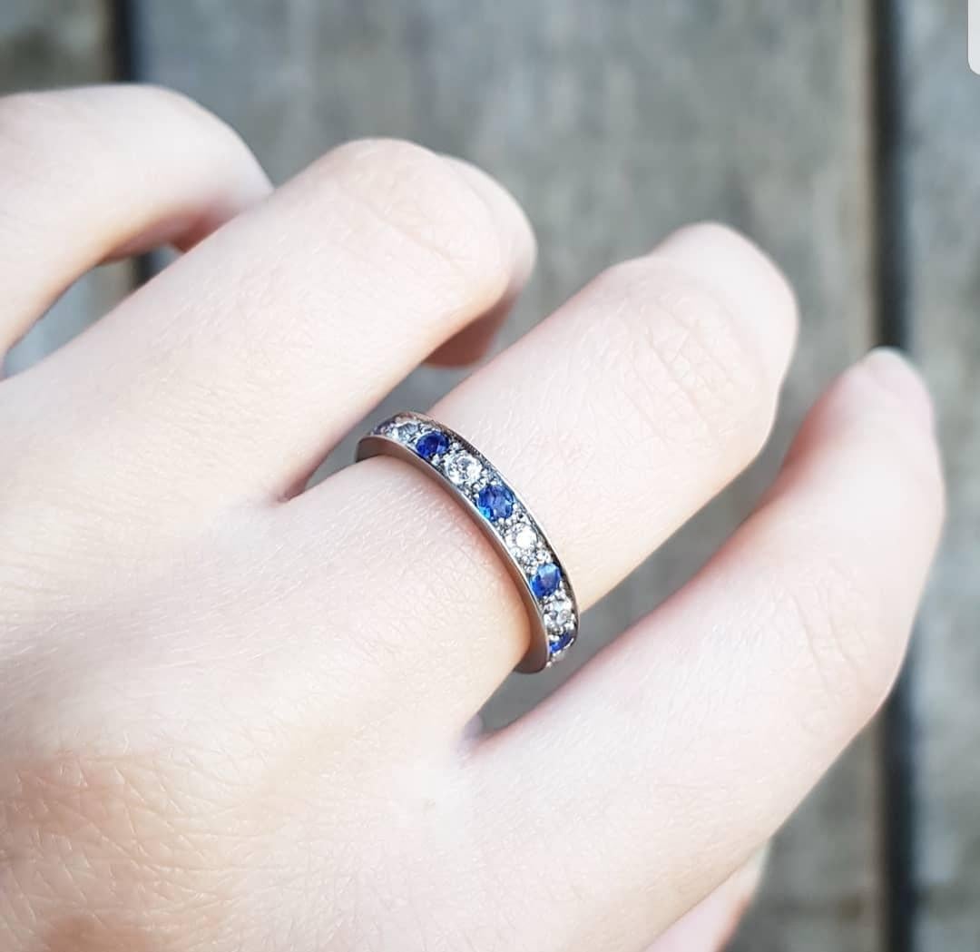 A beautiful full eternity ring in solid white gold set with ten round brilliant cut claw set diamonds and ten 2.5 mm round cut blue sapphires. Total estimated diamond weight is 0.50 carat and the ring weight is 3.16 grammes.

Recent valuation