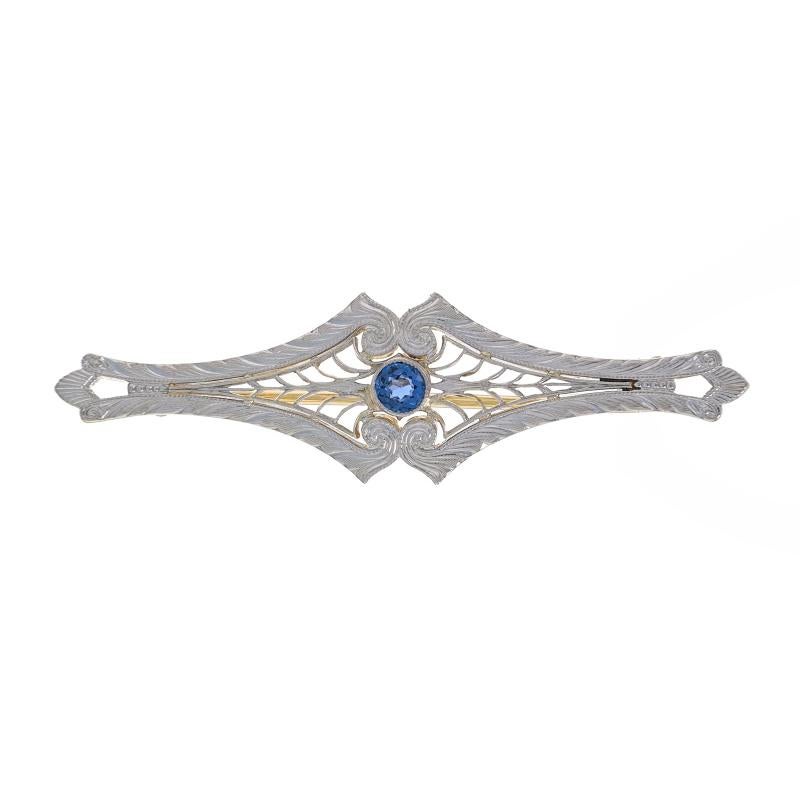 Era: Art Deco
Date: 1920s - 1930s

Metal Content: 14k White Gold & 14k Yellow Gold

Stone Information

Natural Sapphire
Treatment: Heating
Carat(s): .24ct
Cut: Round
Color: Blue

Total Carats: .24ct

Style: Bar Brooch
Fastening Type: Hinged Pin and