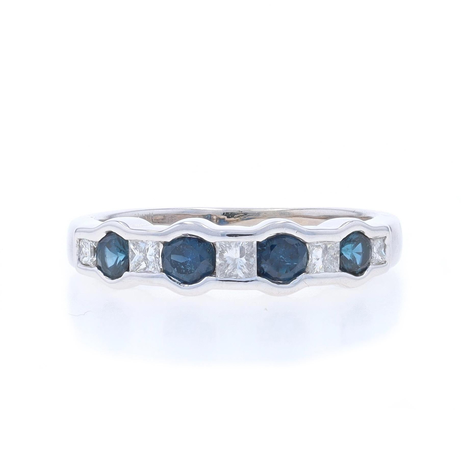 Size: 4 1/2

Metal Content: 14k White Gold

Stone Information

Natural Sapphires
Treatment: Heating
Carat(s): .50ctw
Cut: Round
Color: Blue

Natural Diamonds
Carat(s): .20ctw
Cut: Princess
Color: G - H
Clarity: SI1 - SI2

Total Carats: