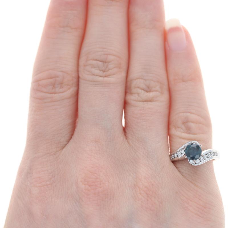 Size: 4 1/2
Sizing Fee: Down 1 for $30 or up 2 for $35

Metal Content: 14k White Gold

Stone Information

Natural Sapphire

Treatment: Heating
Carat(s): .90ct
Cut: Round
Color: Blue

Natural Diamonds
Carat(s): .32ctw
Cut: Round Brilliant
Color: G -