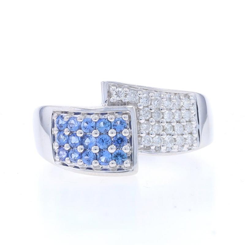 Size: 10 1/4
Sizing Fee: Up 1 1/2 sizes for $35 or Down 1 size for $35

Metal Content: 14k White Gold

Stone Information

Natural Sapphires
Treatment: Heating
Carat(s): .60ctw
Cut: Round Brilliant
Color: Blue

Natural Diamonds
Carat(s): .33ctw
Cut: