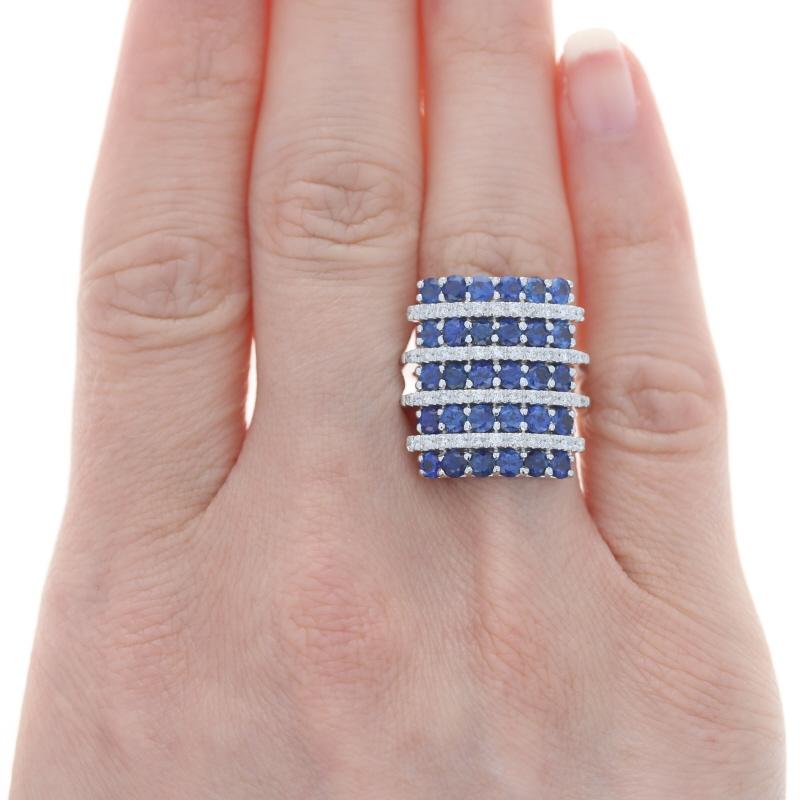 Size: 6 1/4
Sizing Fee: Up 2 sizes for $80

Metal Content: 18k White Gold

Stone Information

Natural Sapphires
Treatment: Heating
Carat(s): 3.36ctw
Cut: Round
Color: Blue

Natural Diamonds
Carat(s): .41ctw
Cut: Round Brilliant
Color: G - H
Clarity: