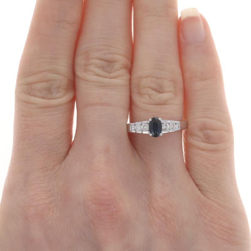 Size: 7 1/2
Sizing Fee: Up 1/2 a size for $25 or Down 1/2 a size for $25

Metal Content: 14k White Gold

Stone Information

Natural Sapphire
Treatment: Heating
Carat(s): .60ct
Cut: Oval
Color: Blue

Natural Diamonds
Carat(s): .34ctw
Cut: Round