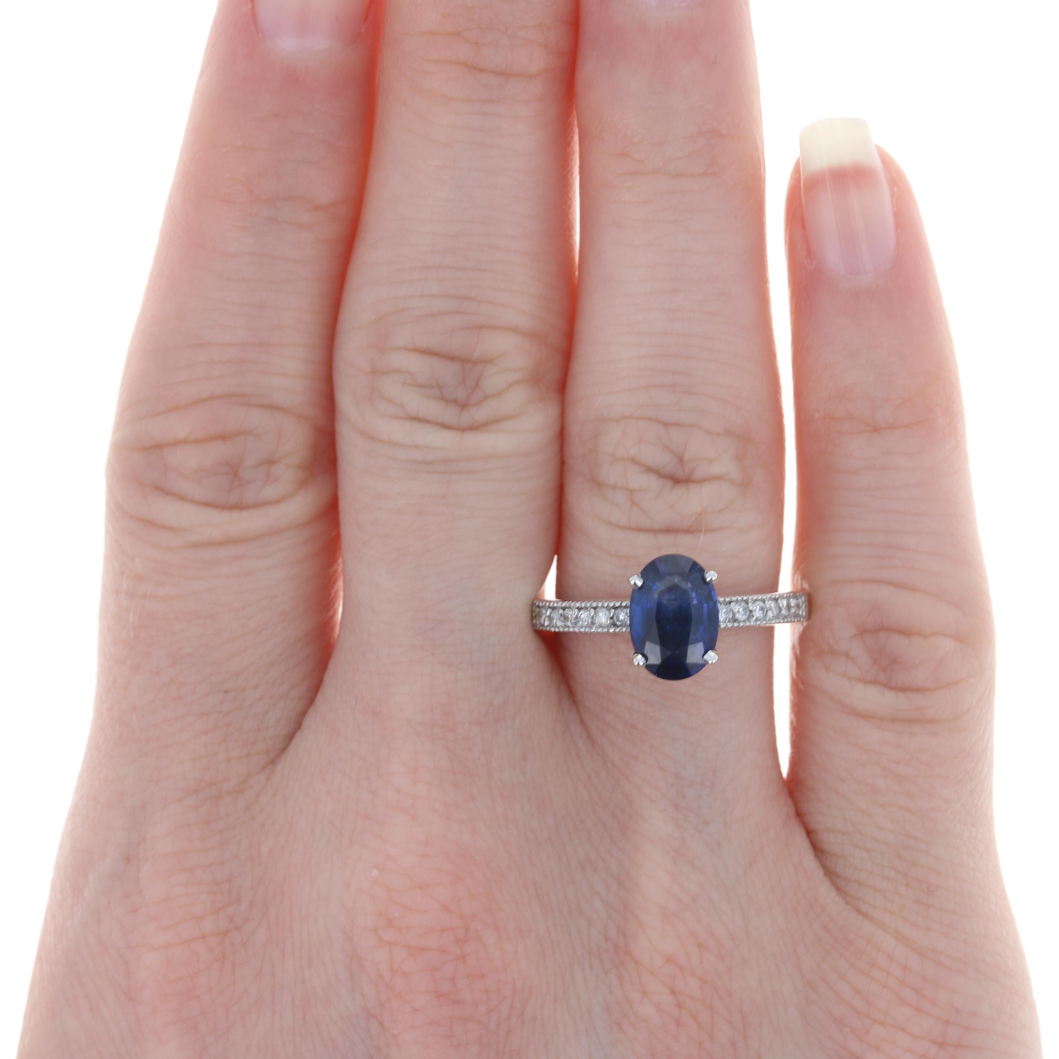 Size: 6 1/2
 Sizing Fee: Up 2 sizes for $30 or Down 1 size for $25
 
 Metal Content: 14k White Gold
 
 Stone Information: 
 Genuine Sapphire
 Treatment: Heating
 Carat: 2.37ct
 Cut: Oval
 Color: Blue 
 Size: 9.3mm x 6.6mm
 
 Natural Diamonds
