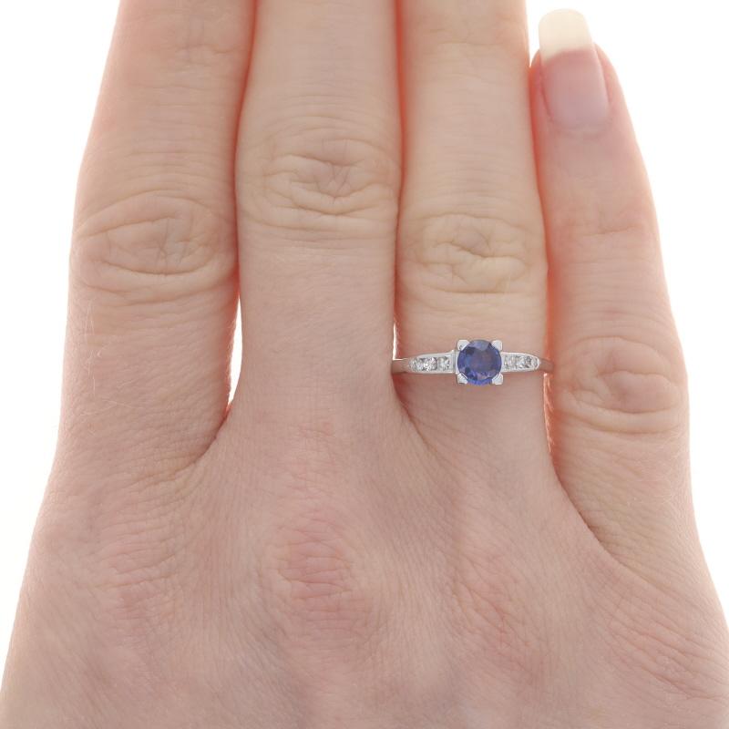 Size: 6 3/4
Sizing Fee: Up 1 size for $35 or Down 2 sizes for $30

Metal Content: 14k White Gold

Stone Information
Natural Sapphire
Treatment: Heating
Carat(s): .42ct
Cut: Round
Color: Blue

Natural Diamonds
Carat(s): .10ctw
Cut: Single
Color: G -