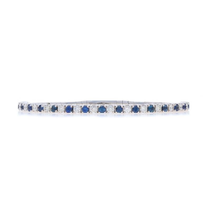 Metal Content: 14k White Gold

Stone Information

Natural Sapphires
Treatment: Heating
Carat(s): 1.56ctw
Cut: Round

Natural Diamonds
Carat(s): 1.31ctw
Cut: Round Brilliant
Color: I - J
Clarity: SI1 - SI2

Total Carats: 2.87ctw

Bracelet Style: Flex