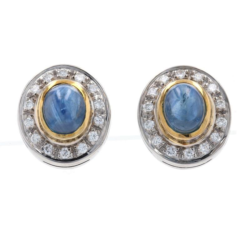 Surprise your September birthday girl with this gorgeous jewelry set! Composed of luxurious 18k white gold, these matching stud earrings and pendant showcase majestic blue sapphire cabochons framed by 18k yellow gold borders and sparkling diamond