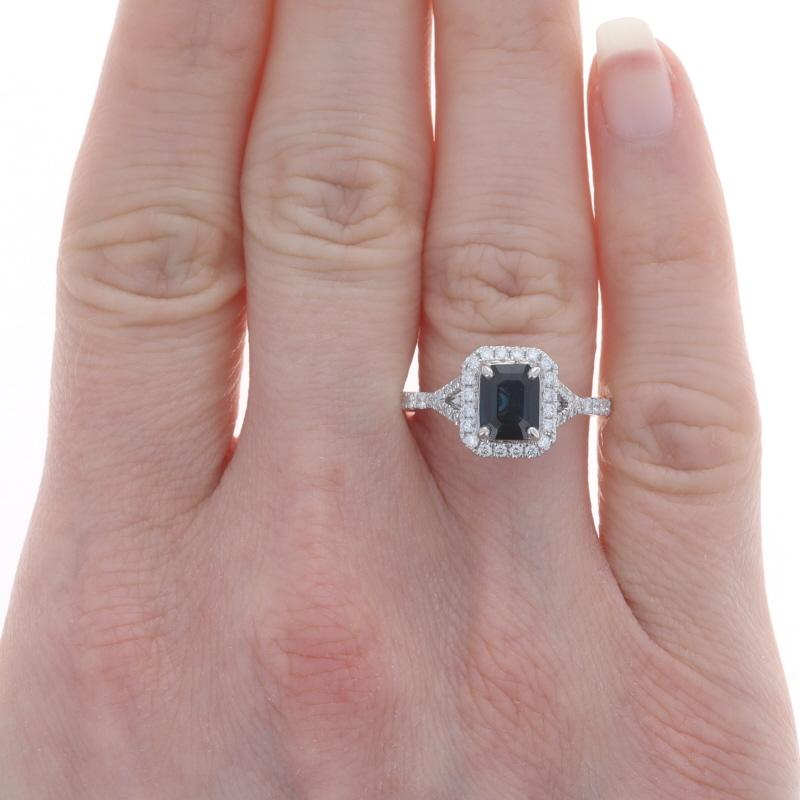 Size: 8
Sizing Fee: Up 2 sizes for $35 or Down 1 size for $35

Metal Content: 14k White Gold

Stone Information
Natural Sapphire
Treatment: Heating
Carat(s): 1.17ct
Cut: Emerald
Color: Blue

Natural Diamonds
Carat(s): .37ctw
Cut: Round