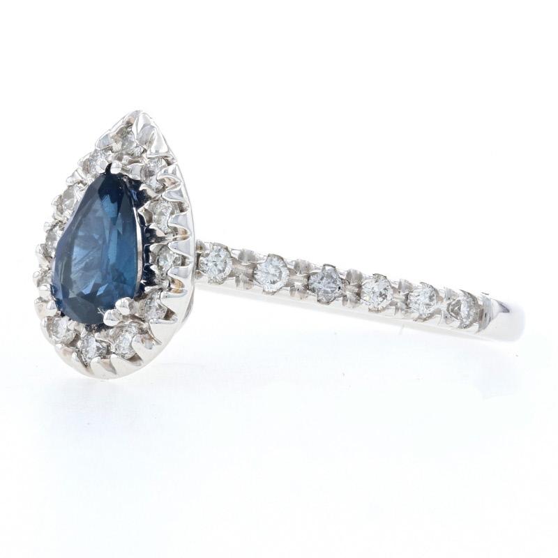 Your quest for the perfect engagement ring ends here with this gorgeous piece! Fashioned in popular 14k white gold, this ring features a stunning pear-cut sapphire solitaire framed in a halo of natural diamonds. More diamond accents adorn the sides