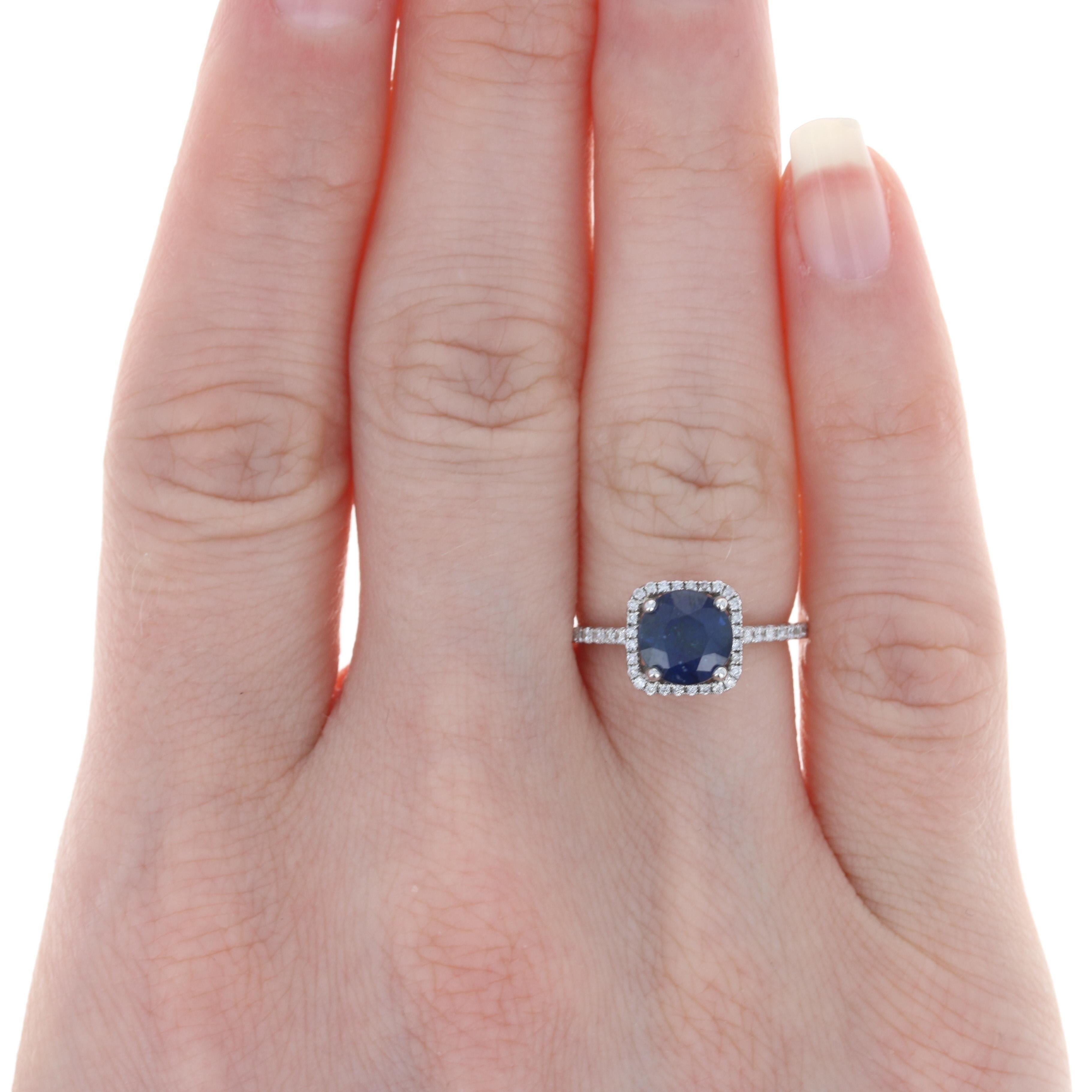 Size: 5
 Sizing Fee: Up 2 sizes for $25 
 
 Metal Content: 14k White Gold
 
 Stone Information: 
 Genuine Sapphire
 Treatment: Heating
 Carat: 1.87ct (weighed)
 Cut: Round
 Color: Blue
 Diameter: 7mm 
 
 Natural Diamonds
 Carats: .20ctw
 Cut: Round