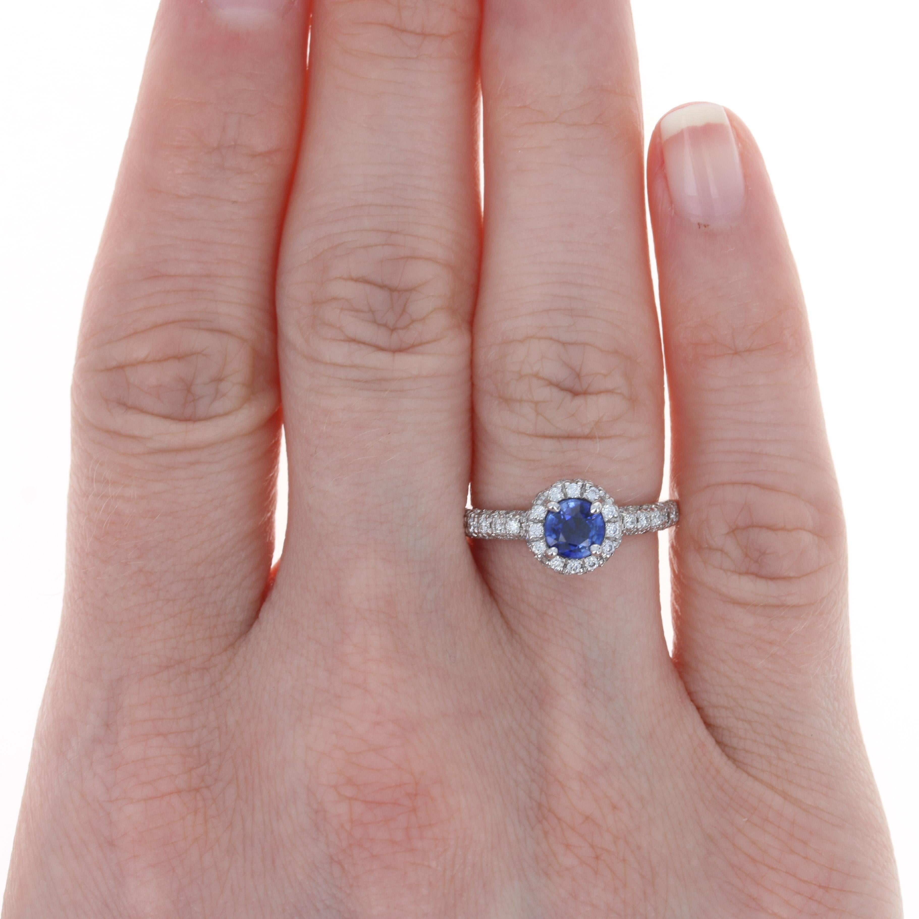 Size: 5 1/4
Sizing Fee: Up 1 size for $30

Metal Content: 14k White Gold 

Stone Information: 
Natural Sapphire
Treatment: Heating 
Carat: .71ct (weighed)
Cut: Round 
Color: Blue 
Diameter: 5.1mm 

Natural Diamonds
Carats: .72ctw
Cut: Round