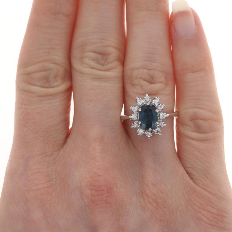 Size: 7
Sizing Fee: Up 2 sizes for $35 or Down 2 sizes for $30

Metal Content: 14k White Gold

Stone Information

Natural Sapphire
Treatment: Heating
Carat(s): 1.54ct
Cut: Oval
Color: Greenish Blue

Natural Diamonds
Carat(s): .20ctw
Cut: Round