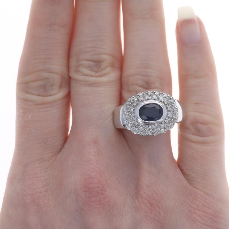 Size: 9 1/4
Sizing Fee: Up 1 size for $40

Metal Content: 14k White Gold

Stone Information

Natural Sapphire
Treatment: Heating
Carat(s): 1.60ct
Cut: Oval
Color: Blue

Natural Diamonds
Carat(s): .65ctw
Cut: Round Brilliant
Color: K - L
Clarity: SI2