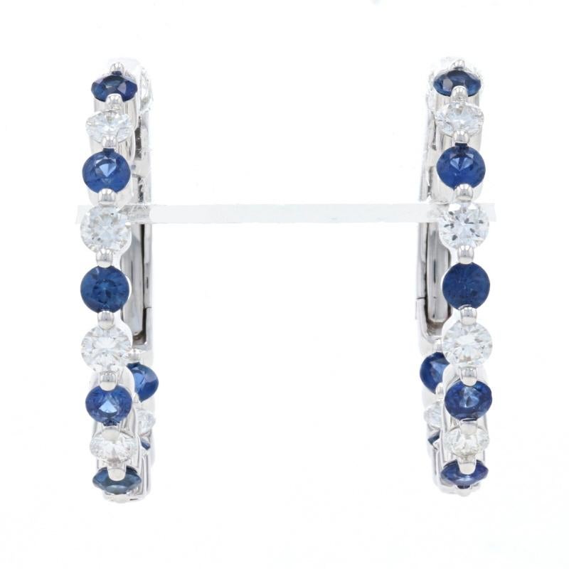 Metal Content: 14k White Gold 

Stone Information: 
Genuine Sapphires 
Treatment: Heating
Carats: .75ctw
Cut: Round 
Color: Blue 

Natural Diamonds
Carats: .50ctw
Cut: Round Brilliant  
Color: F - G 
Clarity: VS2 - SI1

Total Carats: 1.25ctw