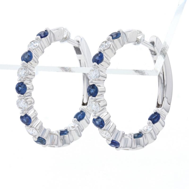 Metal Content: 14k White Gold 

Stone Information: 
Natural Sapphires 
Treatment: Heating
Carats: .75ctw
Cut: Round 
Color: Blue 

Natural Diamonds
Carats: .50ctw
Cut: Round Brilliant  
Color: F - G 
Clarity: VS2 - SI1

Total Carats: 1.25ctw