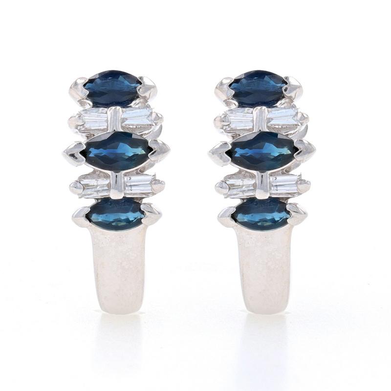 Metal Content: 14k White Gold

Stone Information

Natural Sapphires
Treatment: Heating
Carat(s): 1.28ctw
Cut: Marquise
Color: Blue

Natural Diamonds
Carat(s): .12ctw
Cut: Baguette
Color: G - H
Clarity: VS1 - VS2

Total Carats: 1.40ctw

Style: