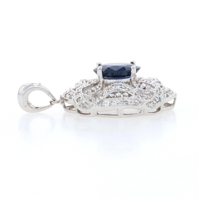 Metal Content: 14k White Gold

Stone Information: 
Genuine Sapphire 
Treatment: Heating
Carat: 1.83ct
Cut: Oval 
Color: Blue   
Size: 8.8mm x 6.8mm

Natural Diamonds
Carats: .20ctw 
Cut: Single 
Color: H - I   
Clarity: SI2 - I1 

Total Carats: