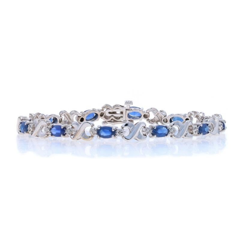 Metal Content: 14k White Gold

Stone Information

Natural Sapphires
Treatment: Heating
Carat(s): 4.20ctw
Cut: Oval
Color: Blue

Natural Diamonds
Carat(s): .07ctw
Cut: Round Brilliant
Color: I - J
Clarity: SI1 - SI2

Total Carats: 4.27ctw

Style: