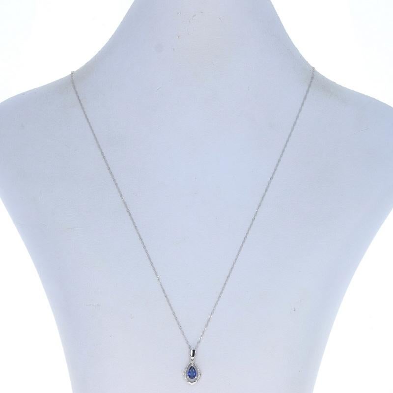 Metal Content: 18k White Gold

Stone Information

Genuine Sapphire
Treatment: Heating
Carats: .48ct
Cut: Pear
Color: Blue

Natural Diamonds
Carats: .03ctw
Cut: Round Brilliant
Color: G
Clarity: VS1 - VS2

Total Carats: .51ctw

Chain Style: