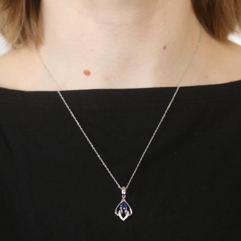 Metal Content: 18k White Gold

Stone Information

Natural Sapphire
Treatment: Heating
Carat: .64ct
Cut: Pear
Color: Blue

Natural Diamonds
Carats: .04ctw
Cut: Round Brilliant
Color: G
Clarity: VS1 - VS2

Total Carats: .68ctw

Chain Style:
