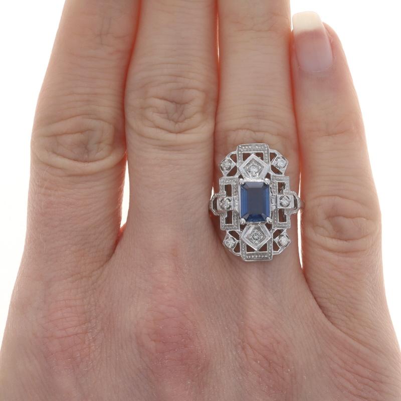Size: 5 1/2
Sizing Fee: Up 2 sizes for $35 or Down 2 sizes for $35

Metal Content: 14k White Gold

Stone Information

Natural Sapphire
Treatment: Heating
Carat(s): 1.23ct
Cut: Emerald
Color: Blue

Natural Diamonds
Carat(s): .20ctw
Cut: Round