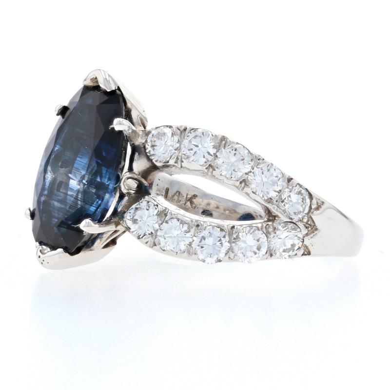 Size: 6 3/4
Sizing Fee: Up sizes for $25

Metal Content: 14k White Gold

Stone Information: 
Genuine Sapphire
Treatment: Heating
Carat(s): 2.84ct
Cut: Modified Oval
Color: Blue

Natural Diamonds
Carat(s): 1.00ctw
Cut: Round Brilliant
Color: G -