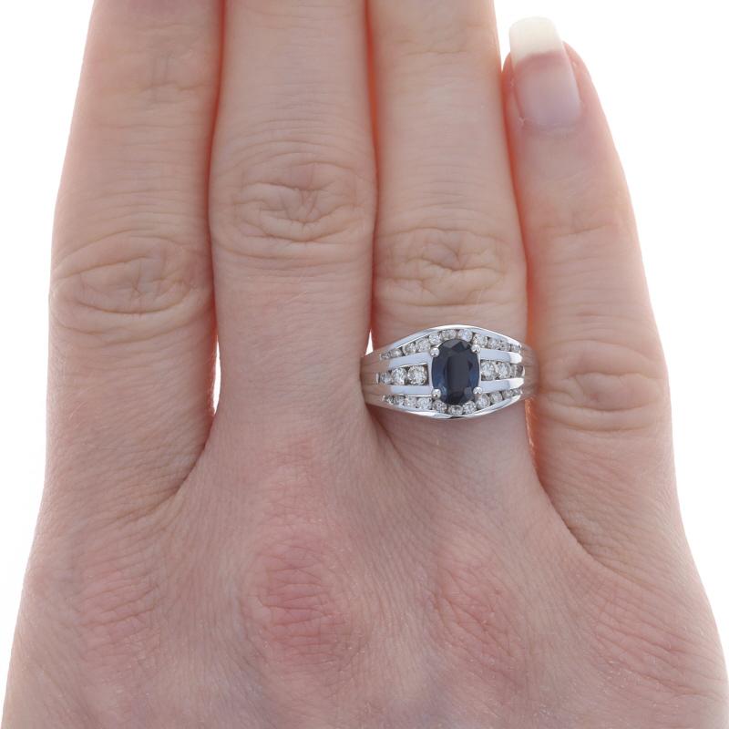 Size: 6 1/2
Sizing Fee: Up 1/2 a size for $30 or Down 1/2 a size for $30

Metal Content: 14k White Gold

Stone Information

Natural Sapphire
Treatment: Heating
Carat(s): 1.15ct
Cut: Oval
Color: Blue

Natural Diamonds
Carat(s): .60ctw
Cut: Round