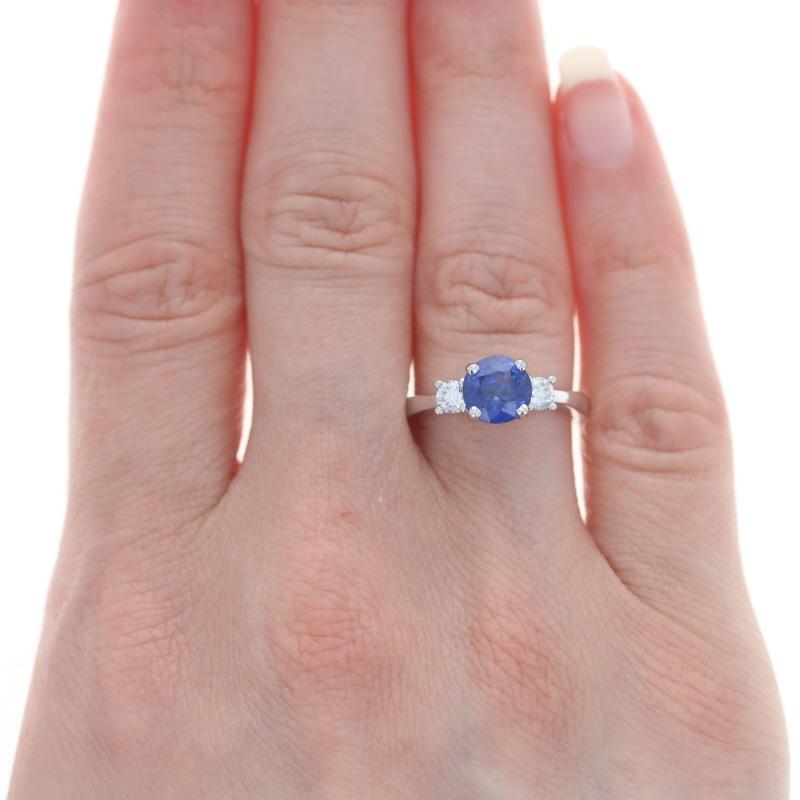 Size: 6 1/2
Sizing Fee: Down 2 sizes for $35 or up 2 sizes for $40

Metal Content: 14k White Gold

Stone Information
Natural Sapphire
Treatment: Heating
Carat(s): 1.83ct
Cut: Round
Color: Blue

Natural Diamonds
Carat(s): .29ctw
Cut: Round