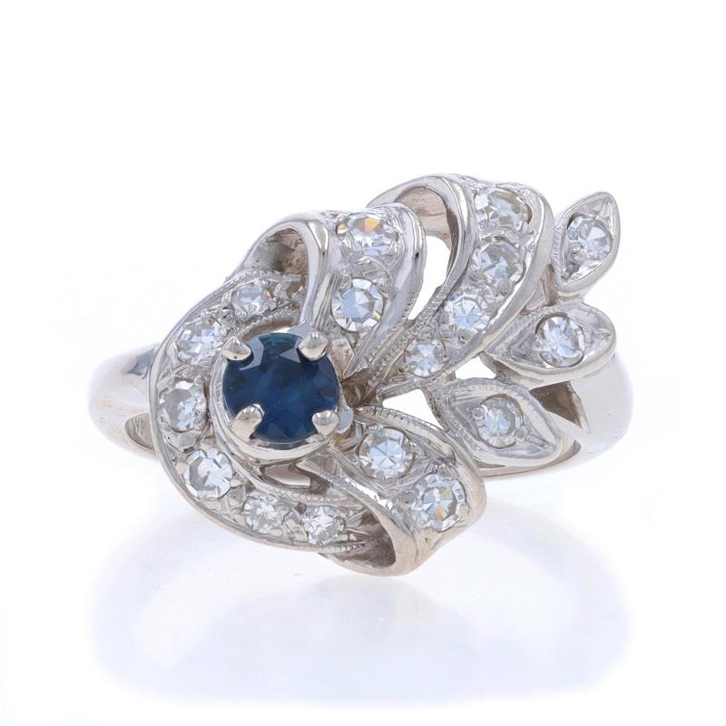 Size: 5 3/4
Sizing Fee: Up 2 1/2 sizes for $40 or Down 1 size for $30

Era: Vintage

Metal Content: 14k White Gold

Stone Information

Natural Sapphire
Treatment: Heating
Carat(s): .34ct
Cut: Round
Color: Blue

Natural Diamonds
Carat(s): .55ctw
Cut: