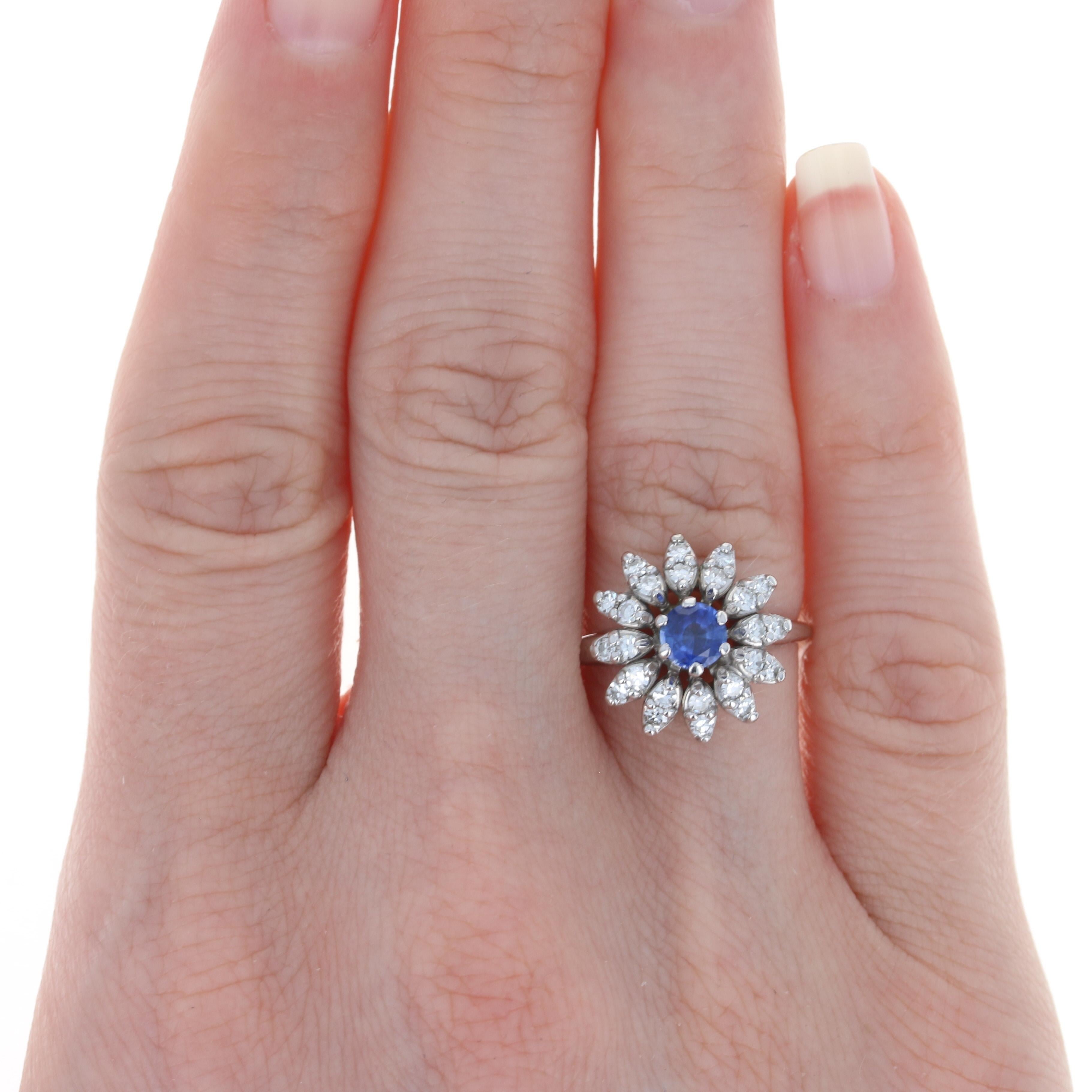 Size: 6 1/2
 Sizing Fee: Up 2 sizes for $25 or down 2 sizes for $20
 
 Era: Vintage
 
 Metal Content: 14k White Gold 
 
 Stone Information: 
 Genuine Sapphire
 Treatment: Heating
 Carat: .50ct
 Cut: Round
 Color: Blue
 Diameter: 4.8mm
 
 Natural