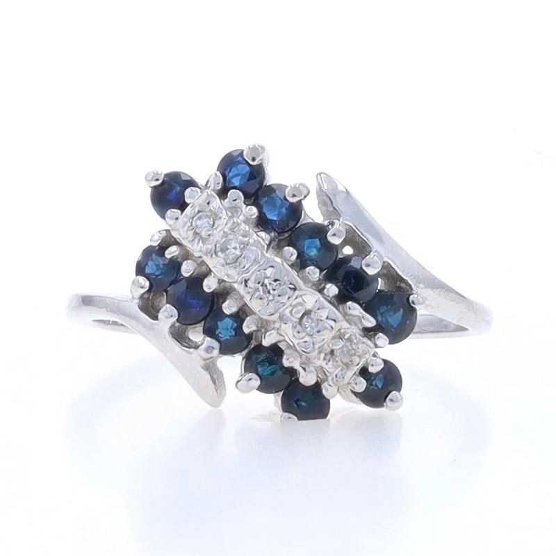 Size: 6
Sizing Fee: Up 2 sizes for $30 or Down 1 1/2 sizes for $30

Metal Content: 10k White Gold

Stone Information

Natural Sapphires
Treatment: Heating
Carat(s): .84ctw
Cut: Round
Color: Blue

Natural Diamonds
Carat(s): .03ctw
Cut: Single
Color: