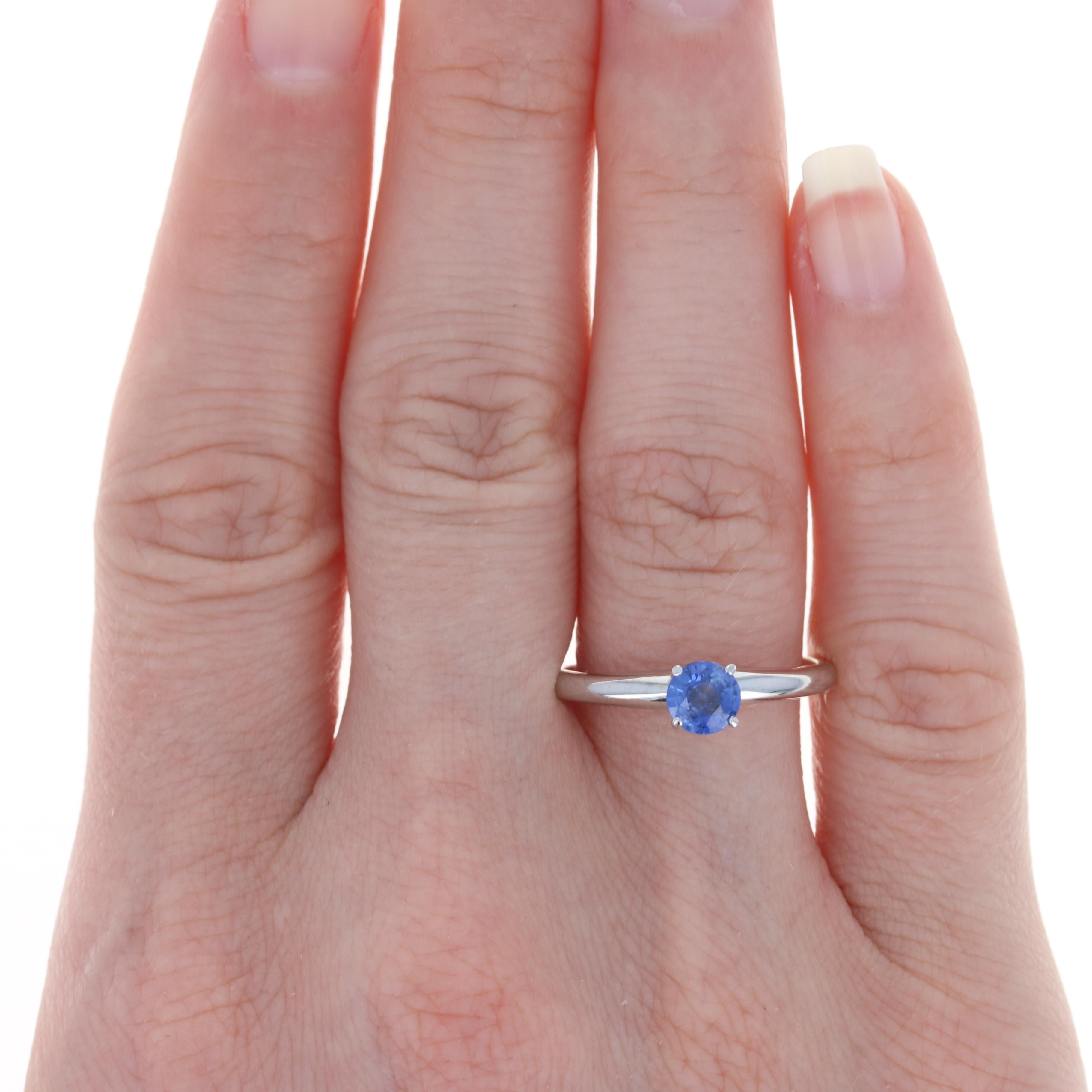 Size: 8 1/2
 Sizing Fee: Up 2 sizes for $25 or Down 4 sizes for $20
 
 Metal Content: 14k White Gold
 
 Stone Information: 
 Genuine Sapphire
 Treatment: Heating
 Carat: .70ct (weighed)
 Cut: Round 
 Color: Blue
 Diameter: 5.2mm 
 
 Style: