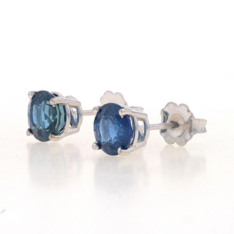 Metal Content: 14k White Gold

Stone Information
Natural Sapphires
Treatment: Heating
Carat(s): 3.10ctw
Cut: Round
Color: Blue

Total Carats: 3.10ctw

Style: Stud
Fastening Type: Butterfly Closures

Measurements
Diameter: 1/4