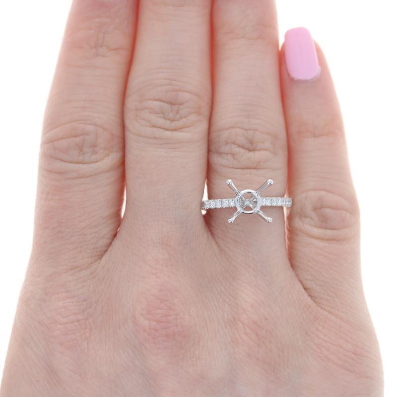 Size: 6 1/2 
Sizing Fee: Up 2 sizes for $35 

Metal Content: 14k White Gold  

Stone Information: 
Natural Diamonds
Total Carats: .28ctw  
Cut: Round Brilliant 
Color: G
Clarity: VS1 - VS2 

Fits Solitaire Size: ~7mm Round

Style: Solitaire with