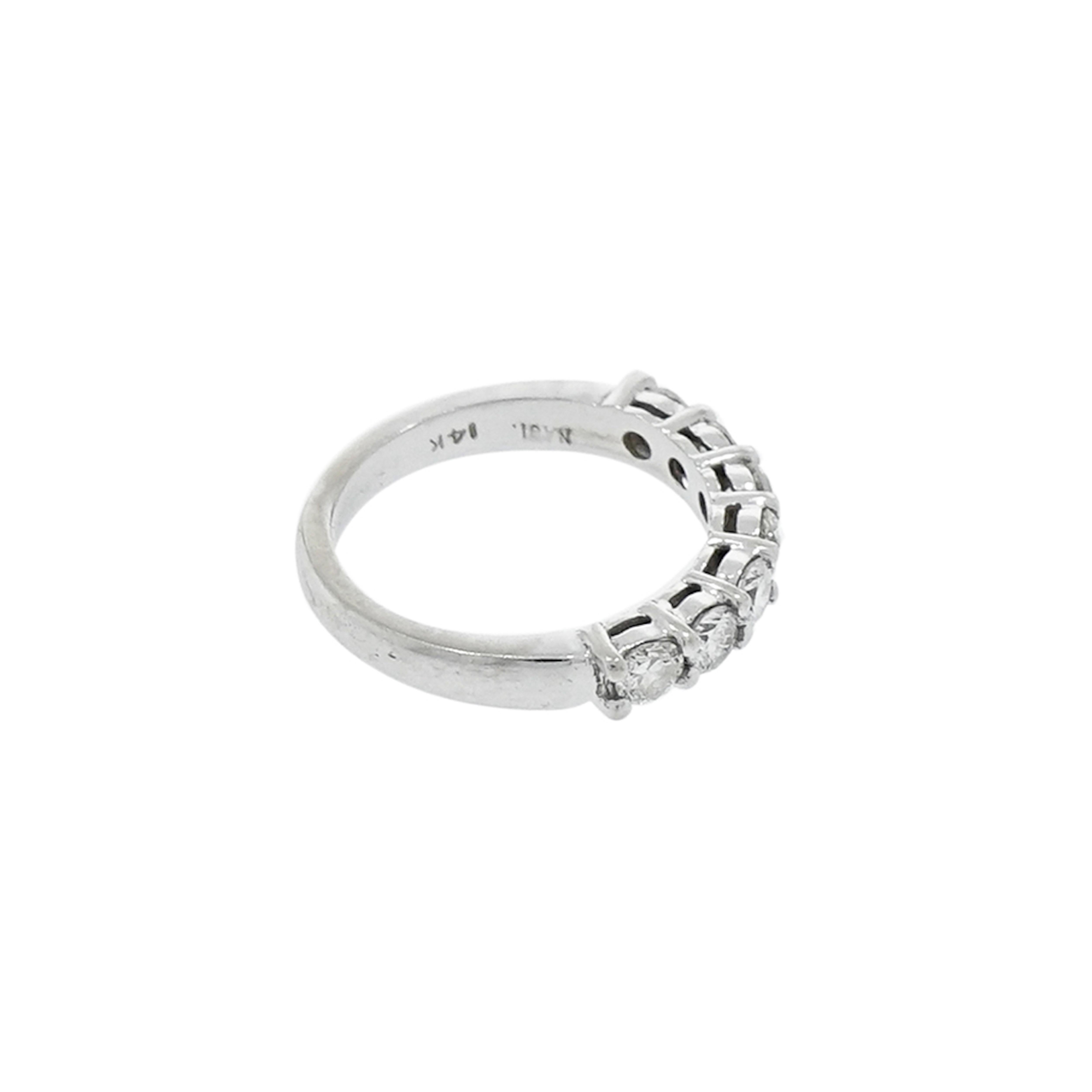 This dazzling Seven Stones diamond anniversary/wedding ring with 0.85carat white round diamonds, H/SI 1. The band measures 3.5mm in width and its crafted for a finger size 5 but can be sized.
