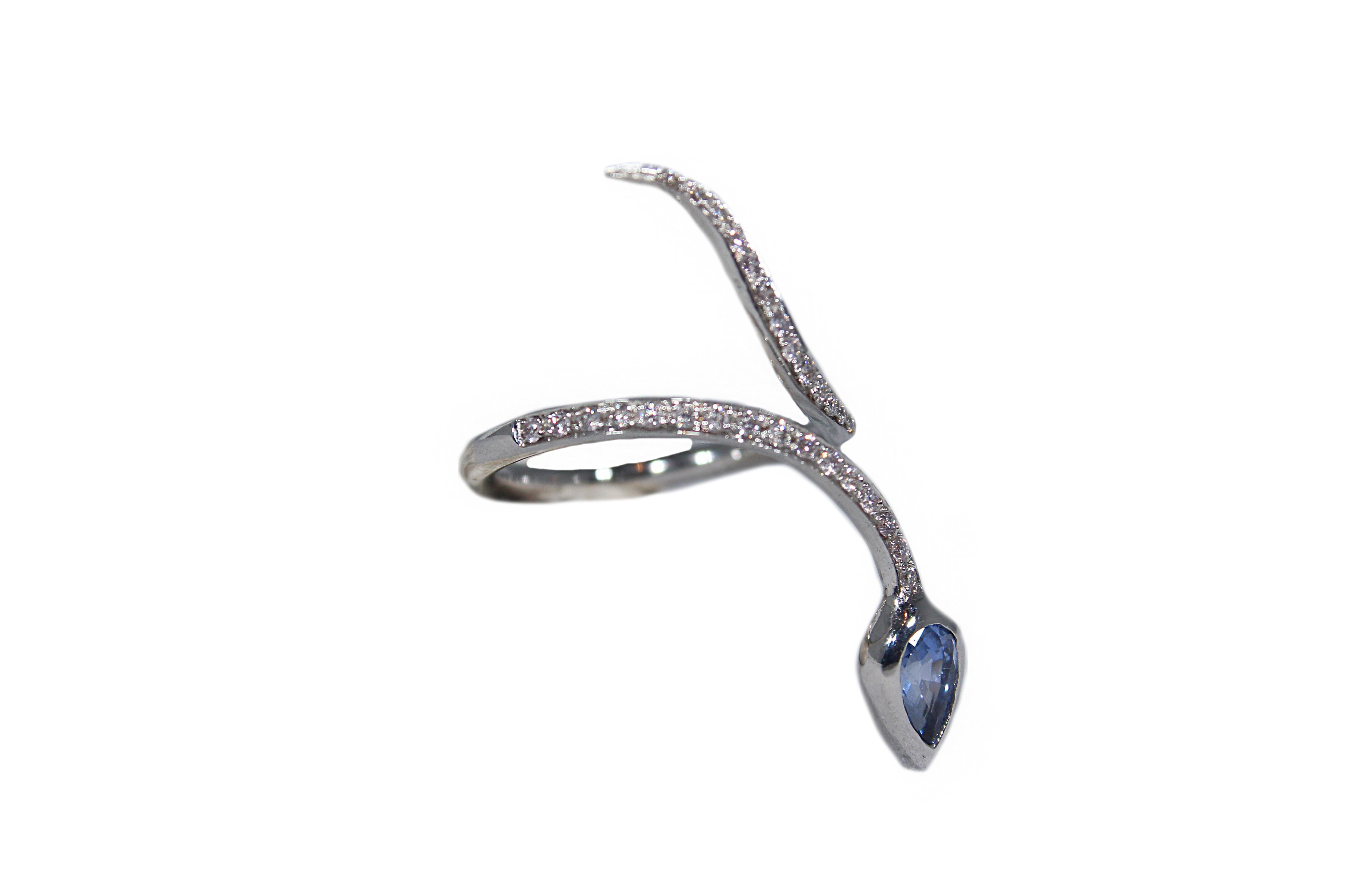 Contemporary White Gold Snakes Ring with Diamonds and Sapphire For Sale