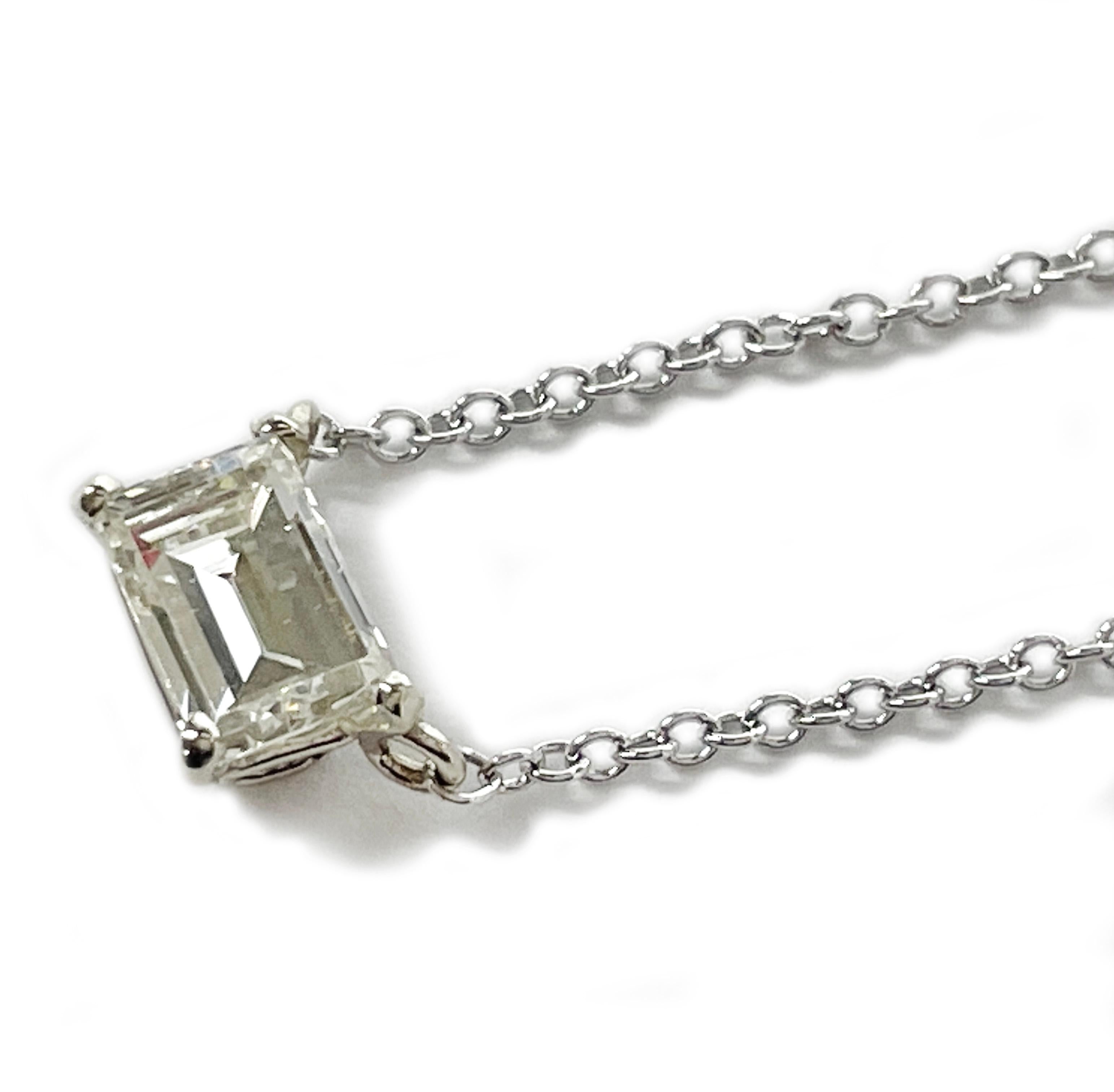 14 Karat White Gold Solitaire Emerald Cut Diamond Pendant Necklace, 0.63 Carat. The diamond measures 5.65 x 3.99 x 2.8mm and has a carat total weight of 0.63ct. The chain measures 18