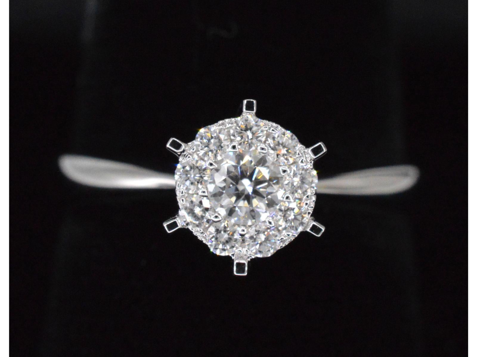 Contemporary White Gold Solitaire Ring with Diamonds For Sale