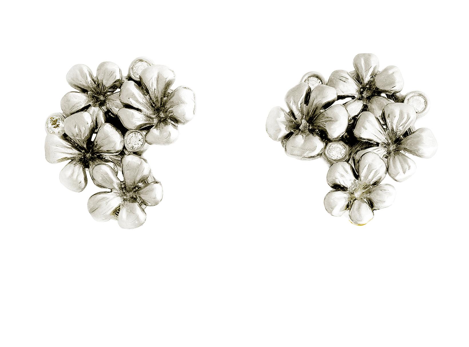 These 14 karat white gold Plum Blossom stud earrings are encrusted with 6 round diamonds (or pink sapphires, or tourmalines) and and neon paraiba tourmalines in pear cut, 8x5 mm each. This jewellery collection was featured in Vogue UA and Harper's